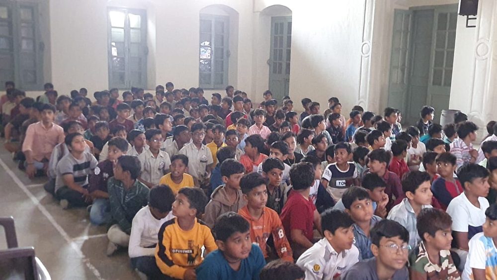 Boys sitting and listening at a Y.Y.P seminar