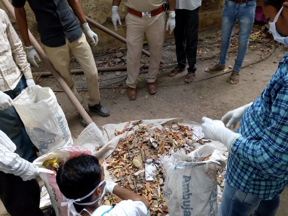 Y.Y.P members collecting leaves and litter during a garden cleanliness drive