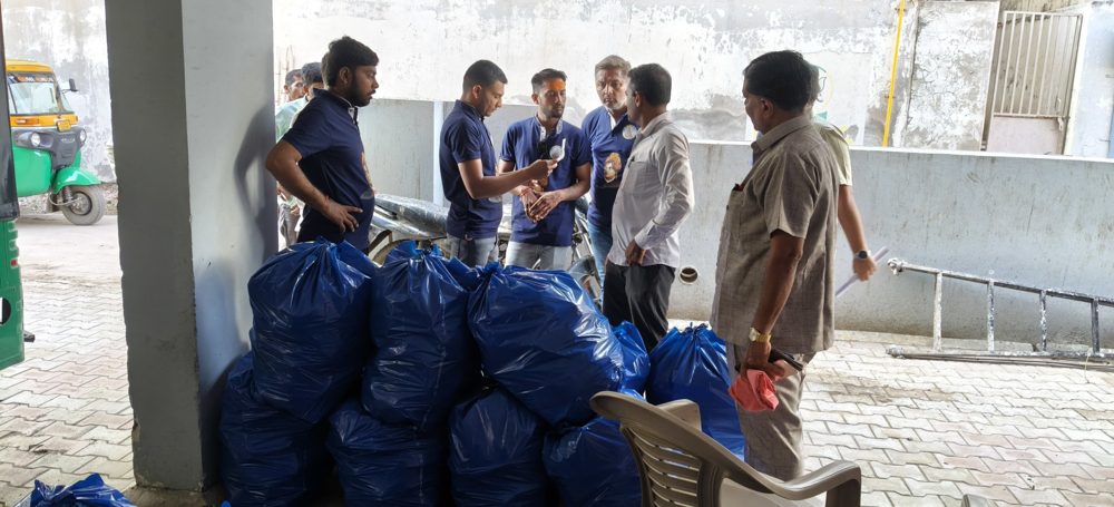 Y.Y.P members with bags of relief material