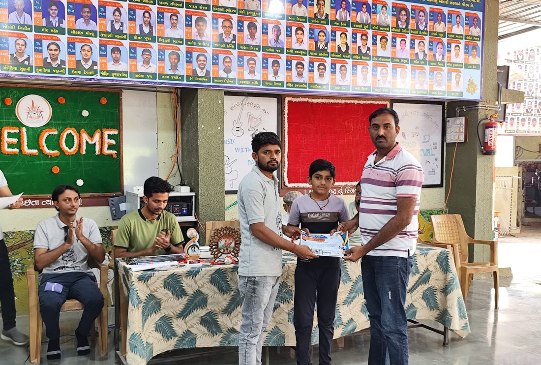 A boy receiving a karate camp certificate