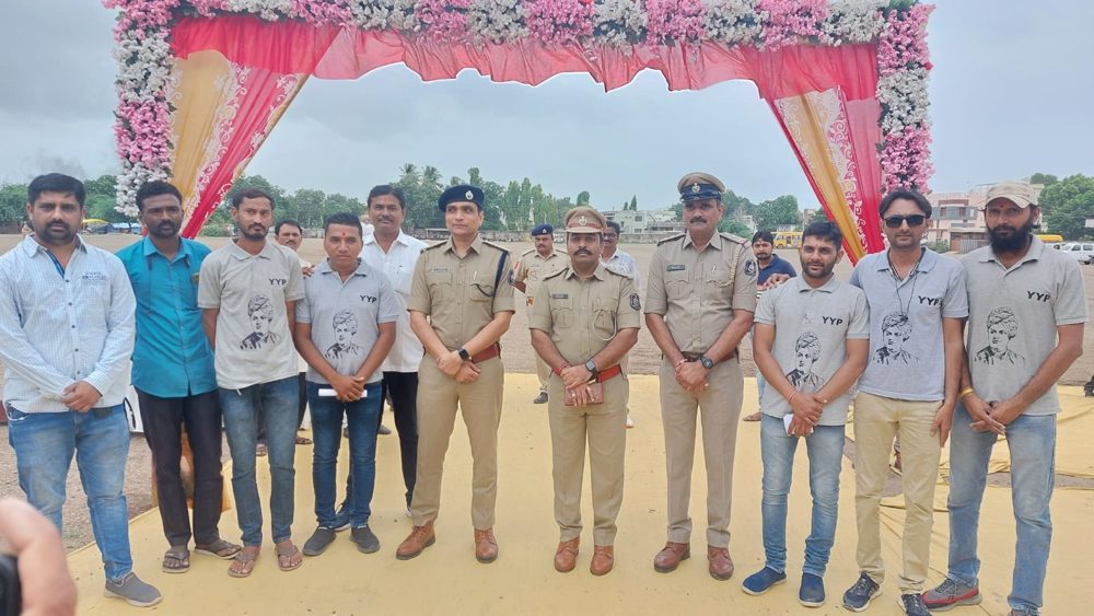Y.Y.P members with police officers at a public programme