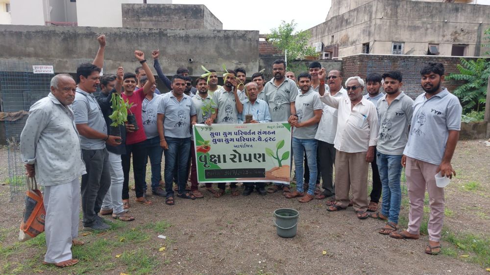 Y.Y.P members with a tree plantation banner